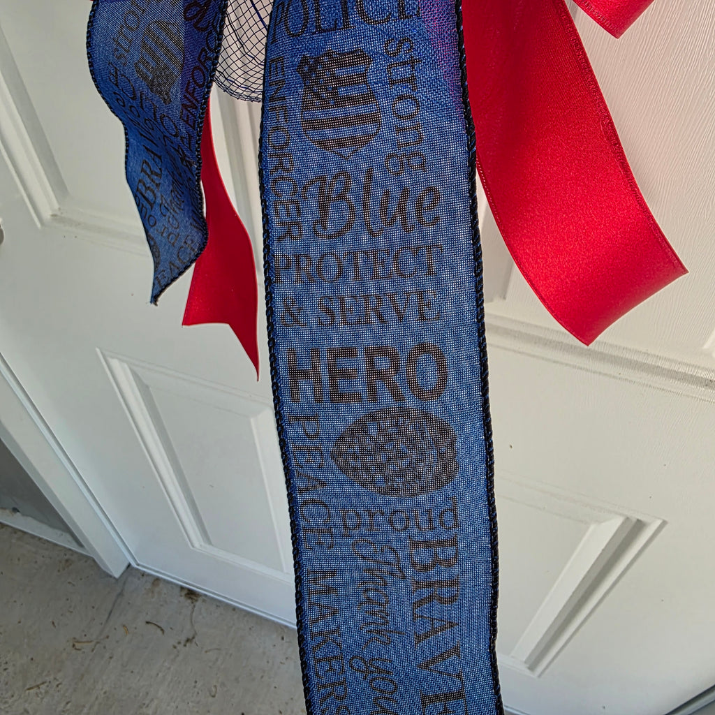 Side angle view of Thin Blue Line door swag on white door showing full length