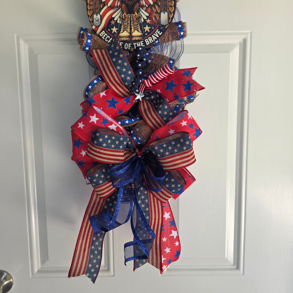 Side angle view of patriotic door swag on white door showing full length