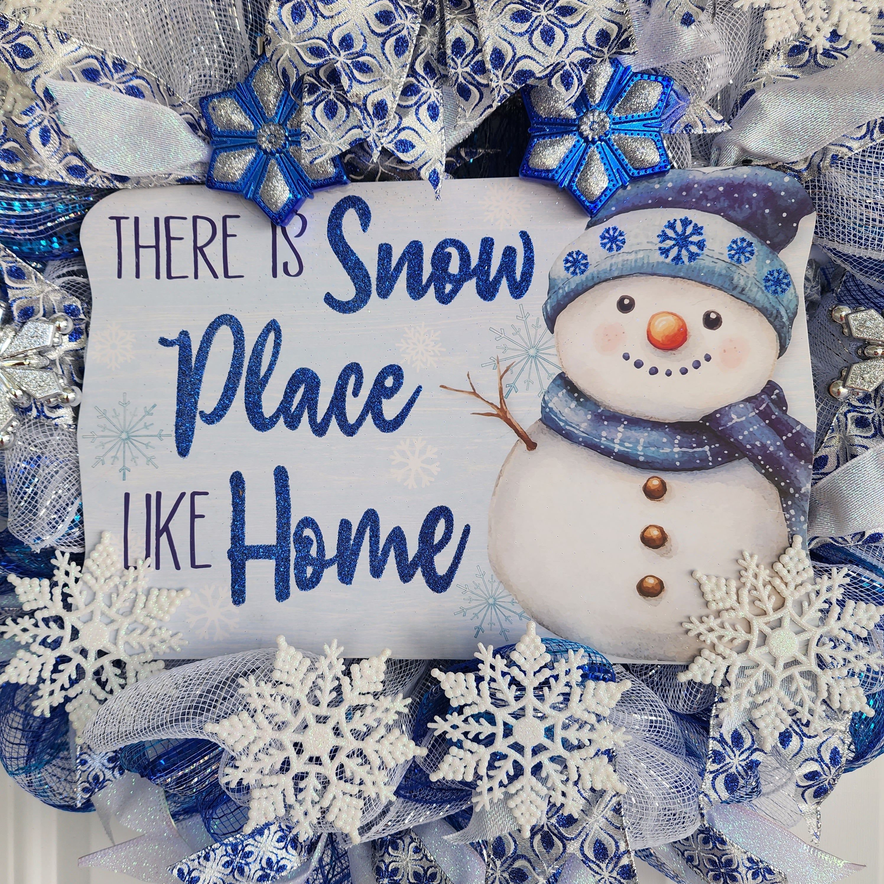 Snow Place Like Home sign detail with snowflakes