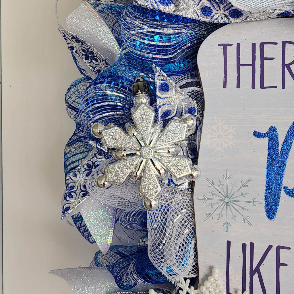 Blue damask bow at top of wreath