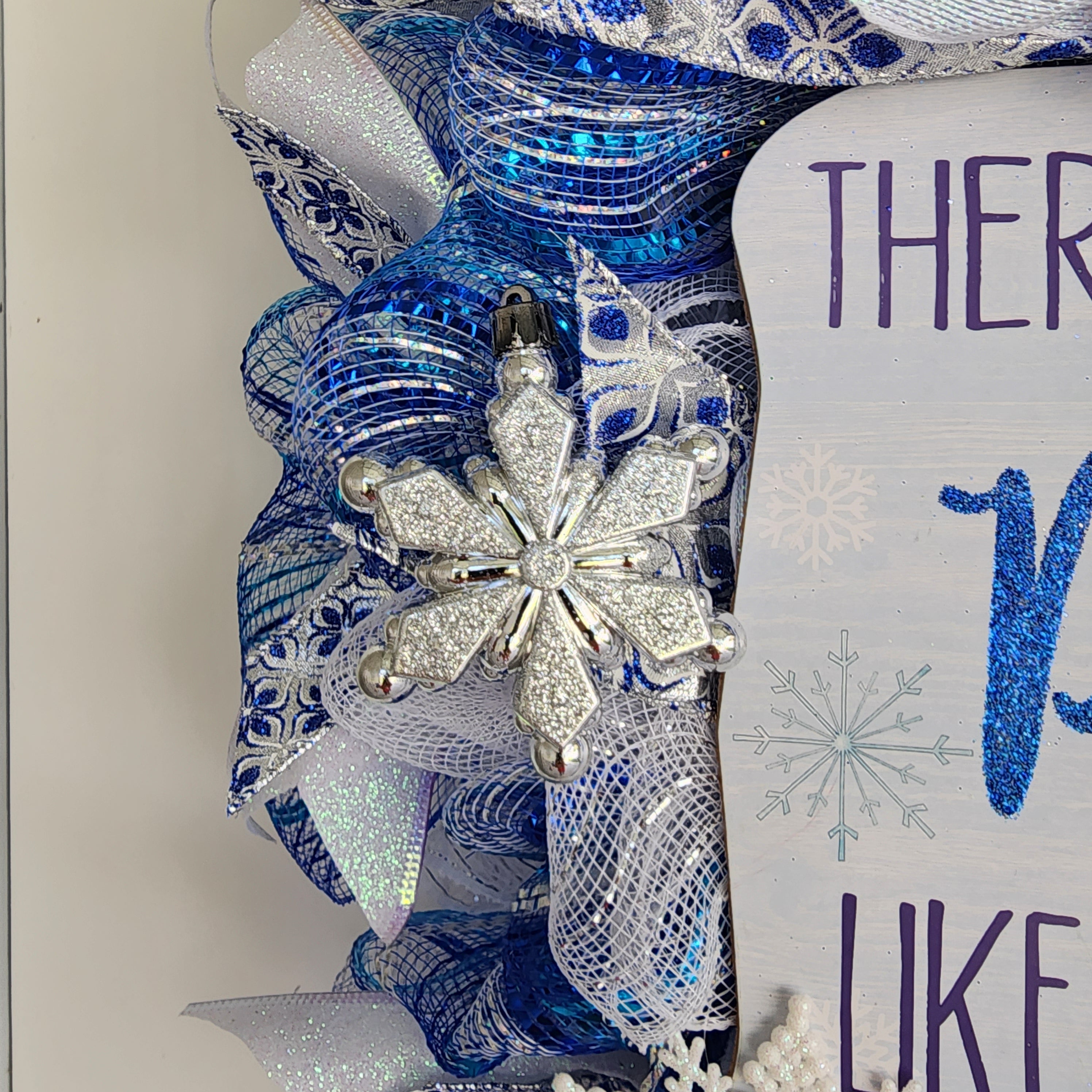 Blue damask bow at top of wreath