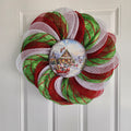 Angled side view of swirl deco mesh wreath on door