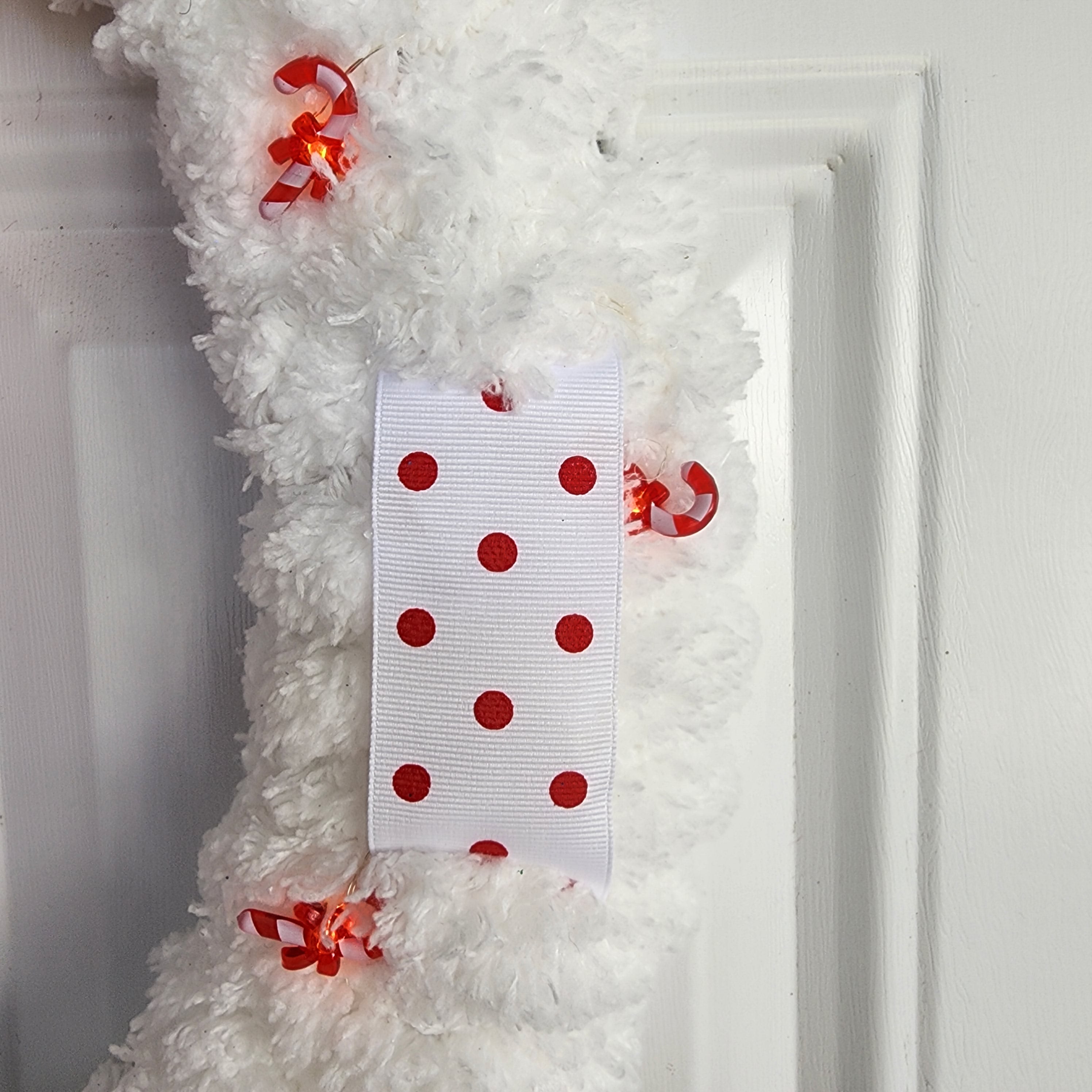 Lighted candy cane with red bow detail