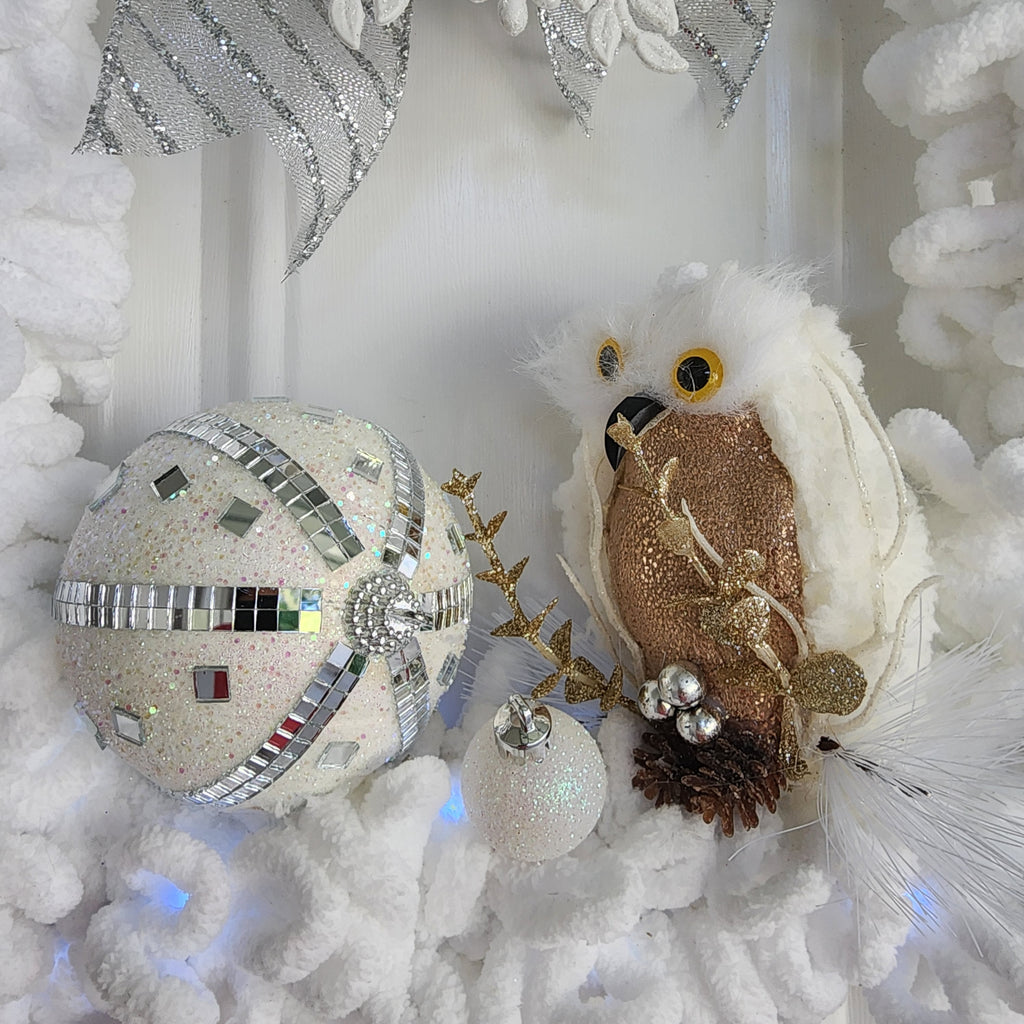 Gold owl with antler sprigs and pinecone