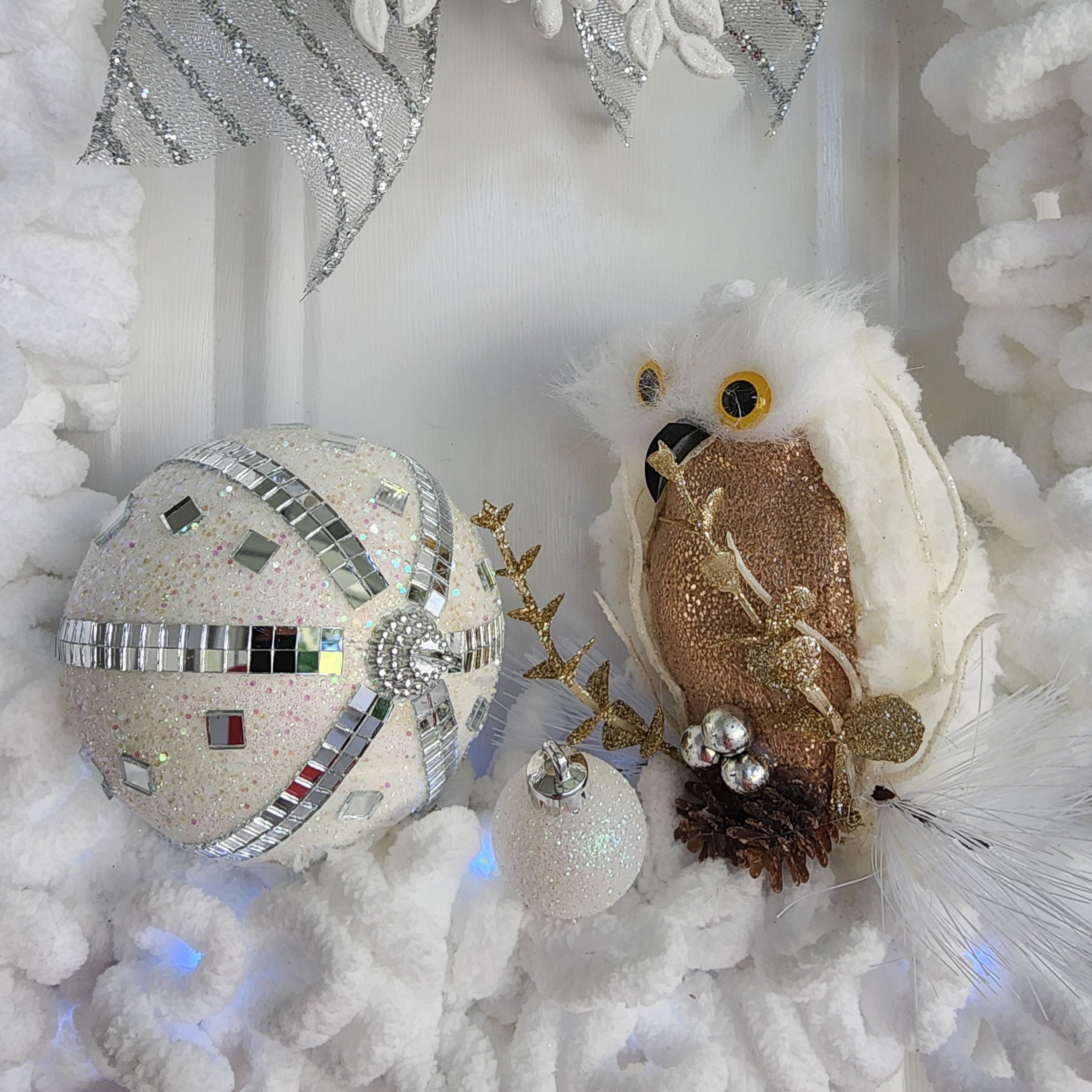 Gold owl with antler sprigs and pinecone