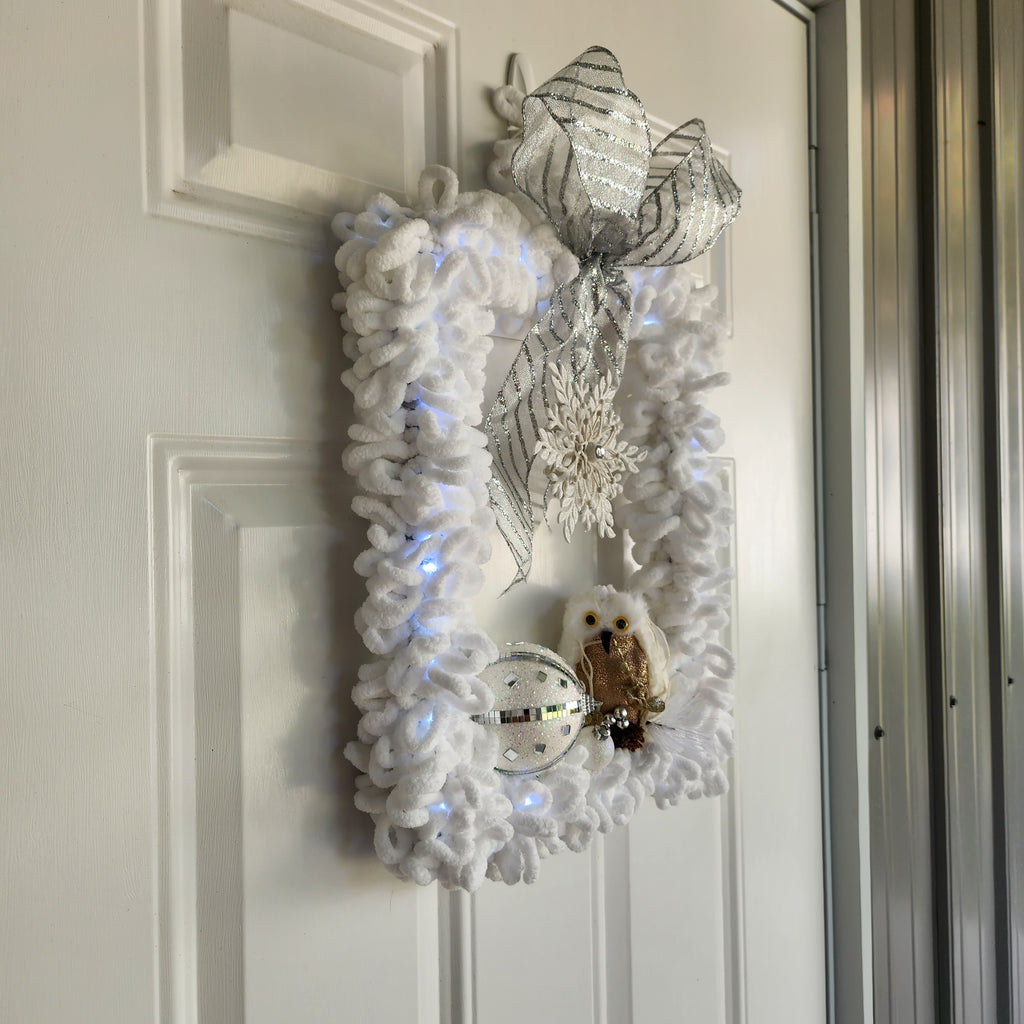 Silver glitter bow and jeweled snowflake centerpiece