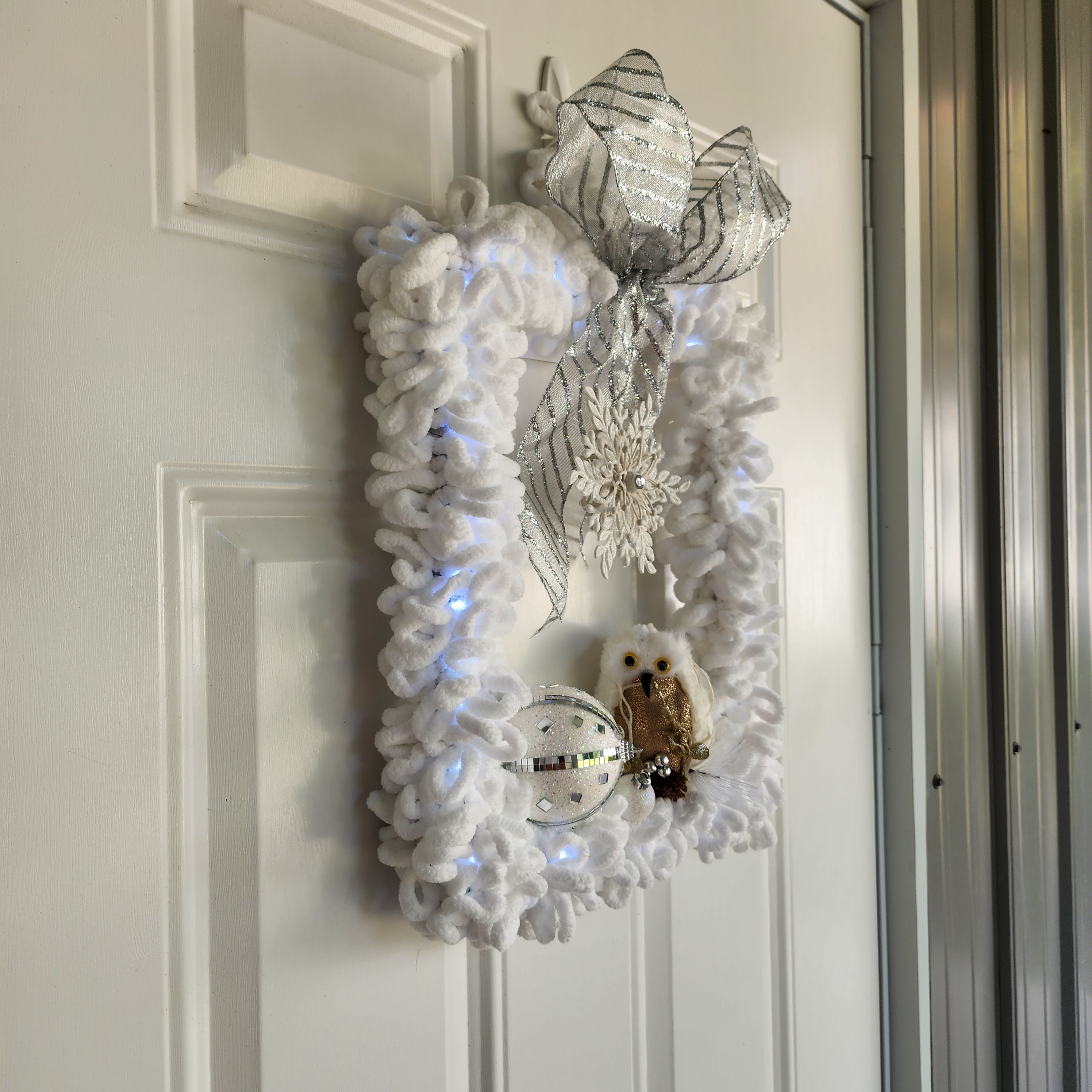 Silver glitter bow and jeweled snowflake centerpiece