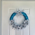 Teal and Silver Poinsettia Wreath angled view