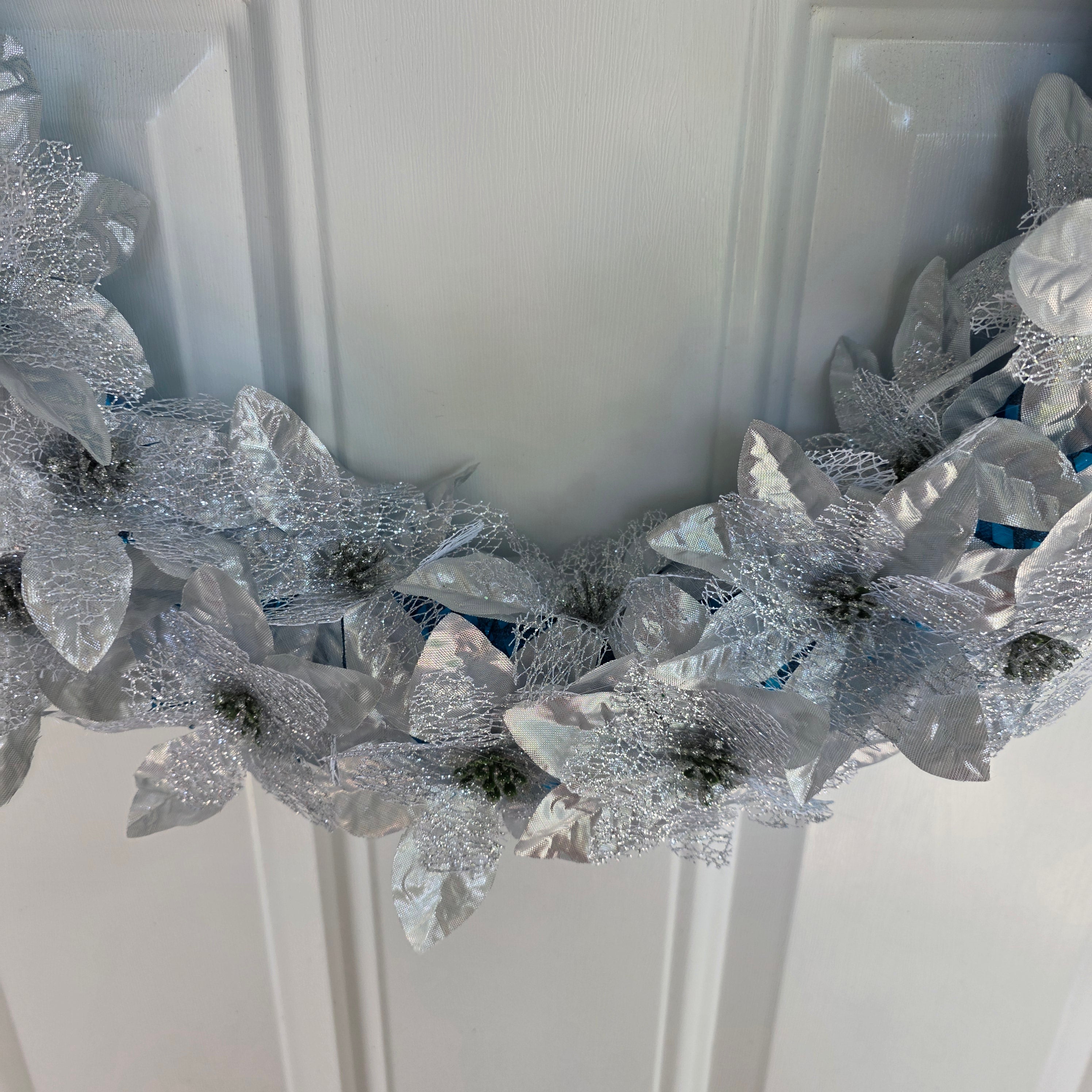 Silver and white poinsettia cascade close-up