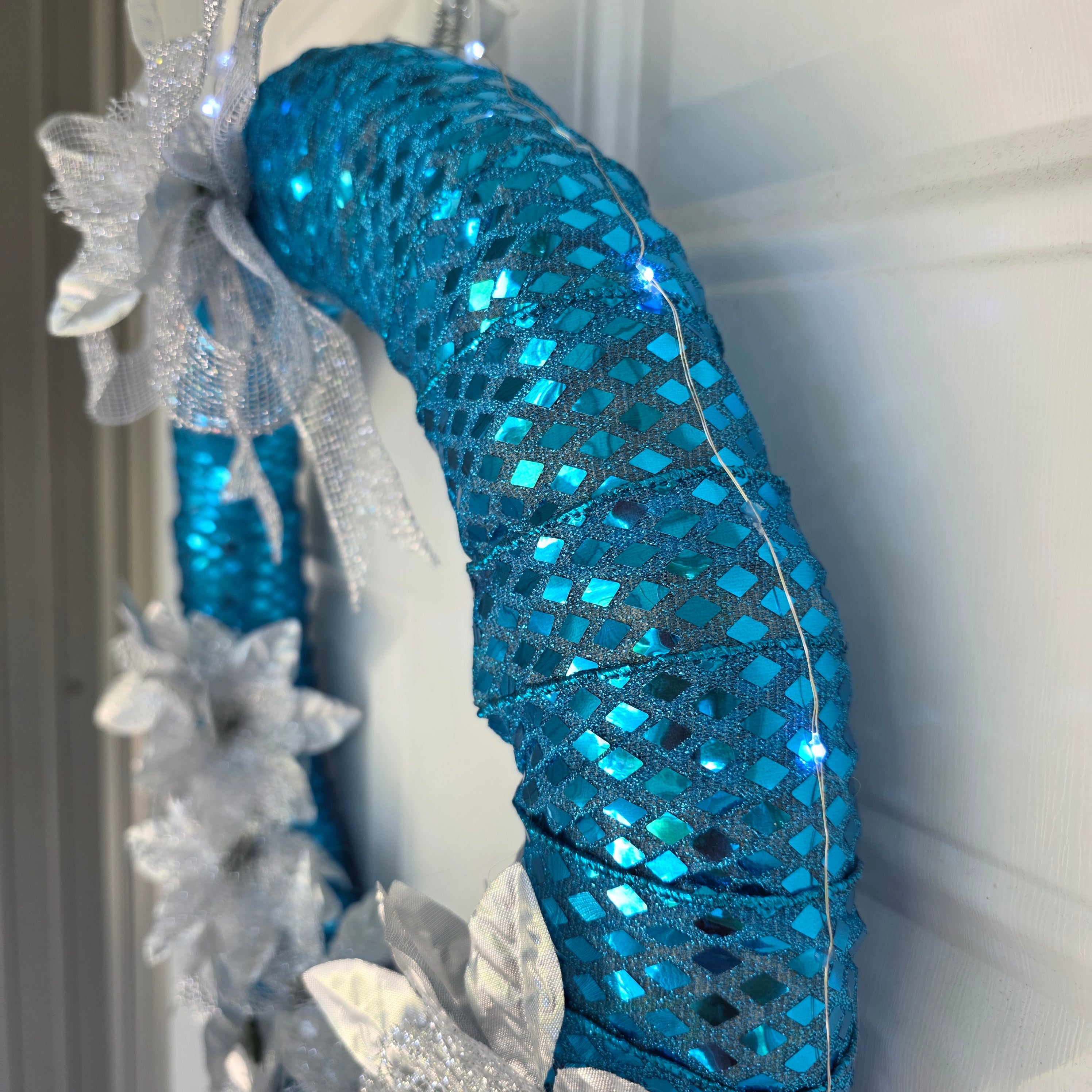 Teal and Silver Poinsettia Wreath full door view
