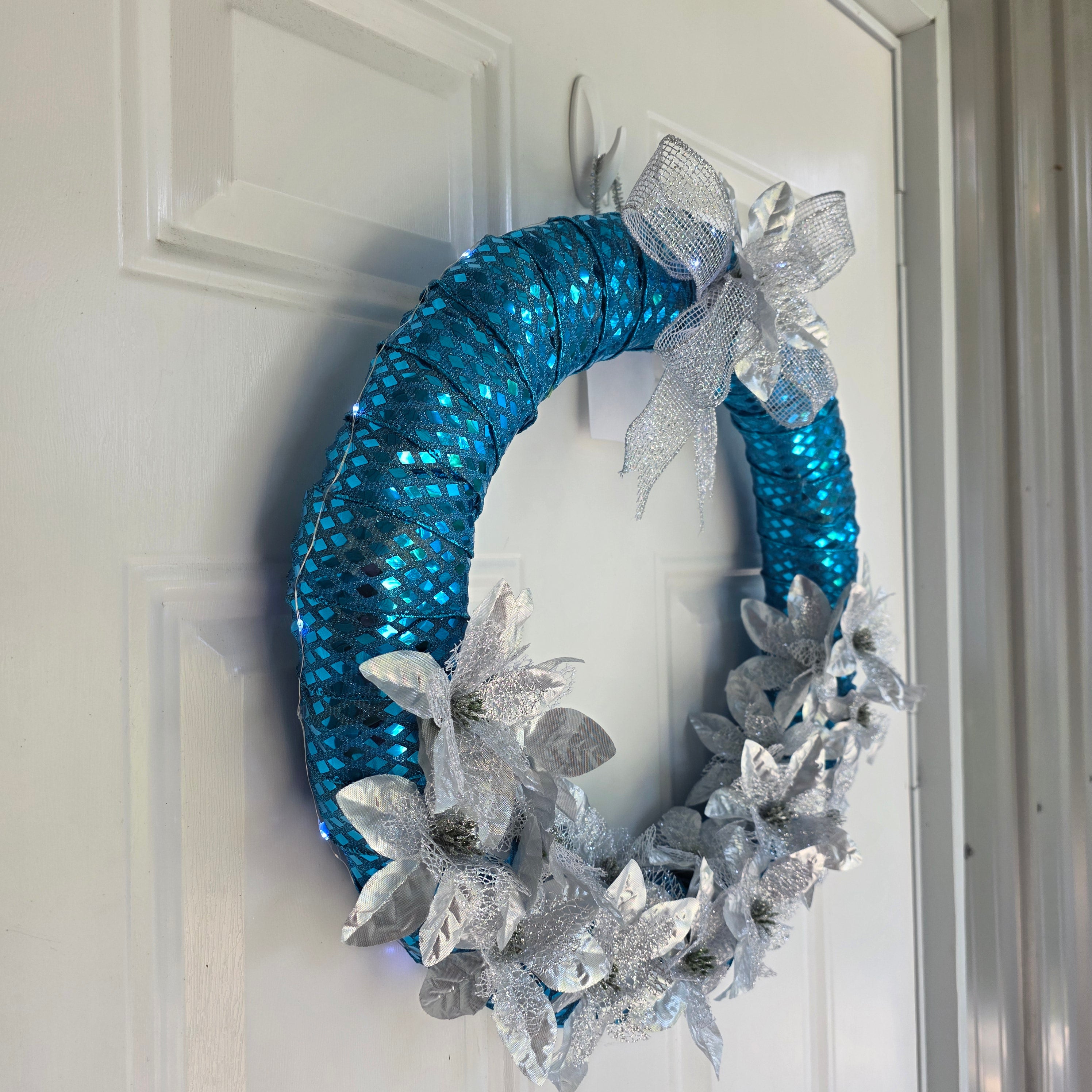 Iridescent teal sequin mesh and fairy lights detail