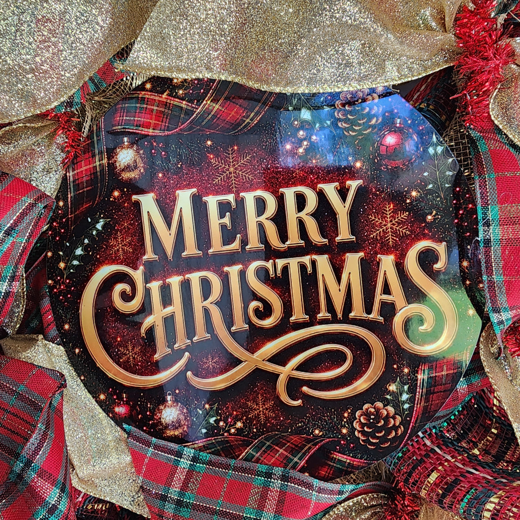 Close-up of Merry Christmas sign and gold ribbon detail