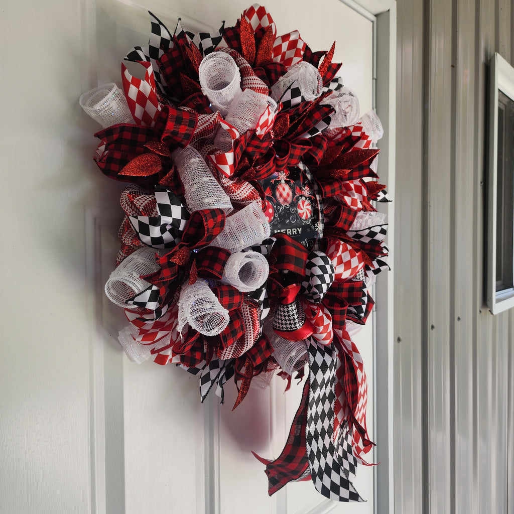 Full wreath hanging on white front door