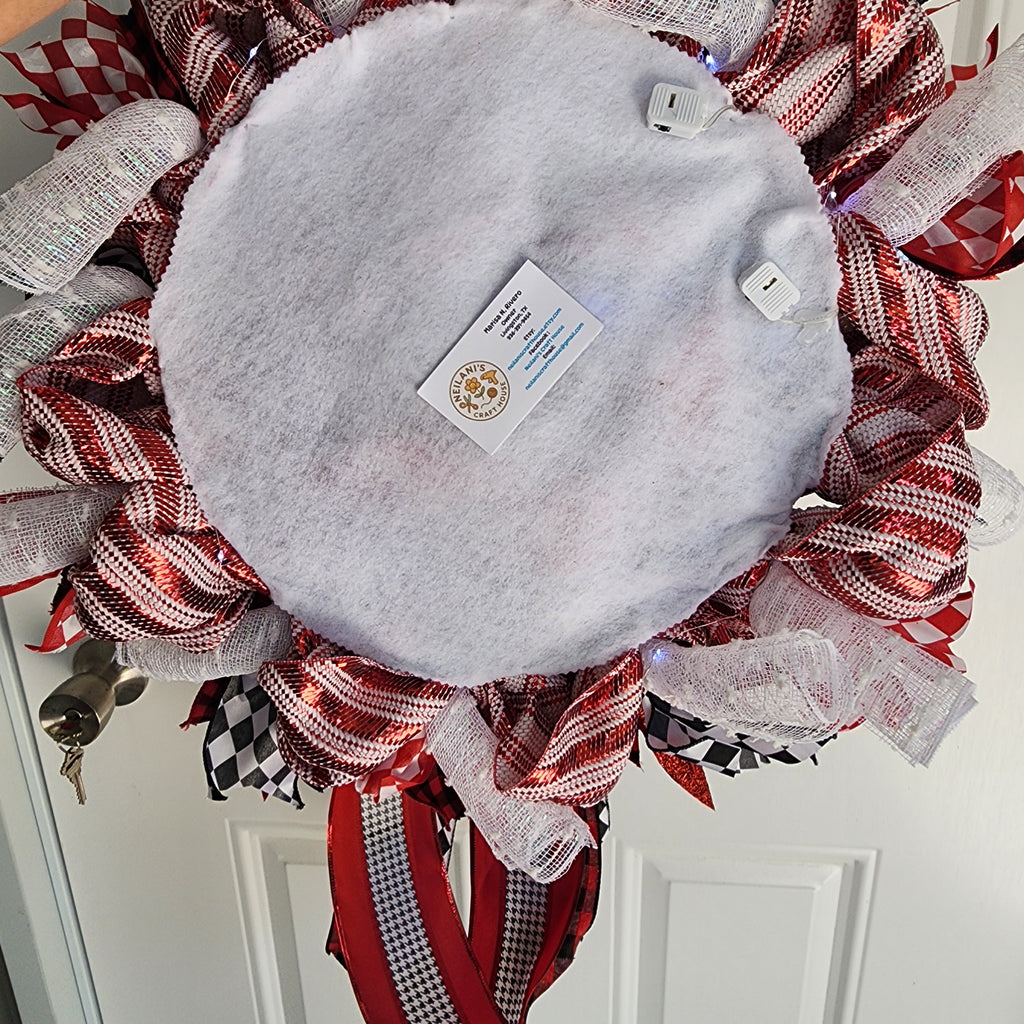 Close-up of buffalo plaid bow with glitter center on Christmas wreath