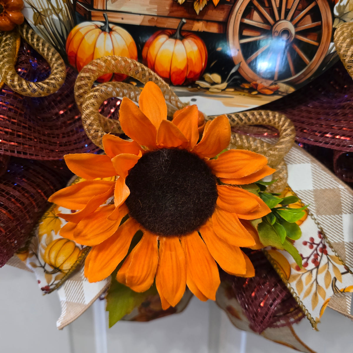 Mini pumpkin pick and jute rope detail on fall wreath