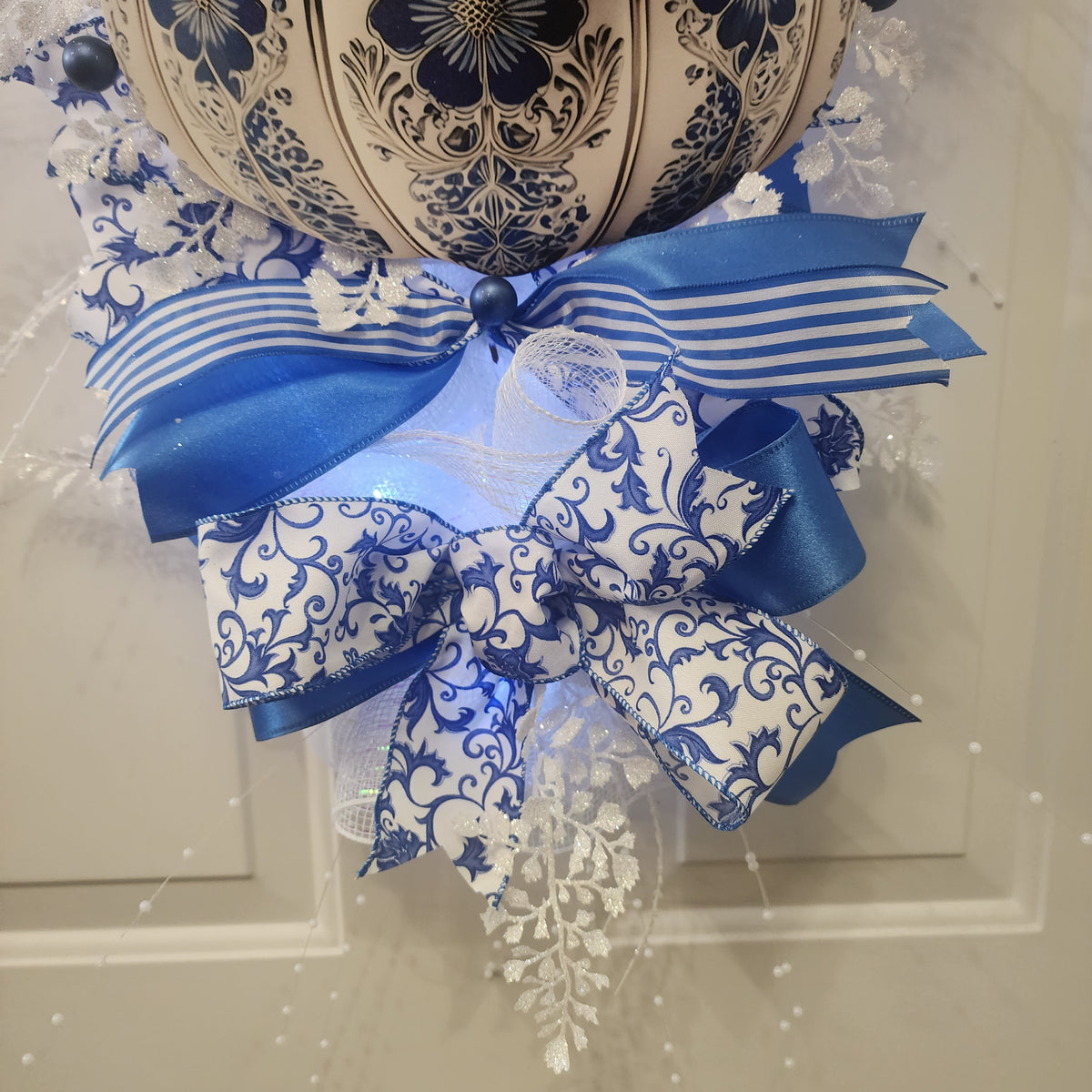 Bottom ribbon bow detail with stripe and scrollwork ribbon