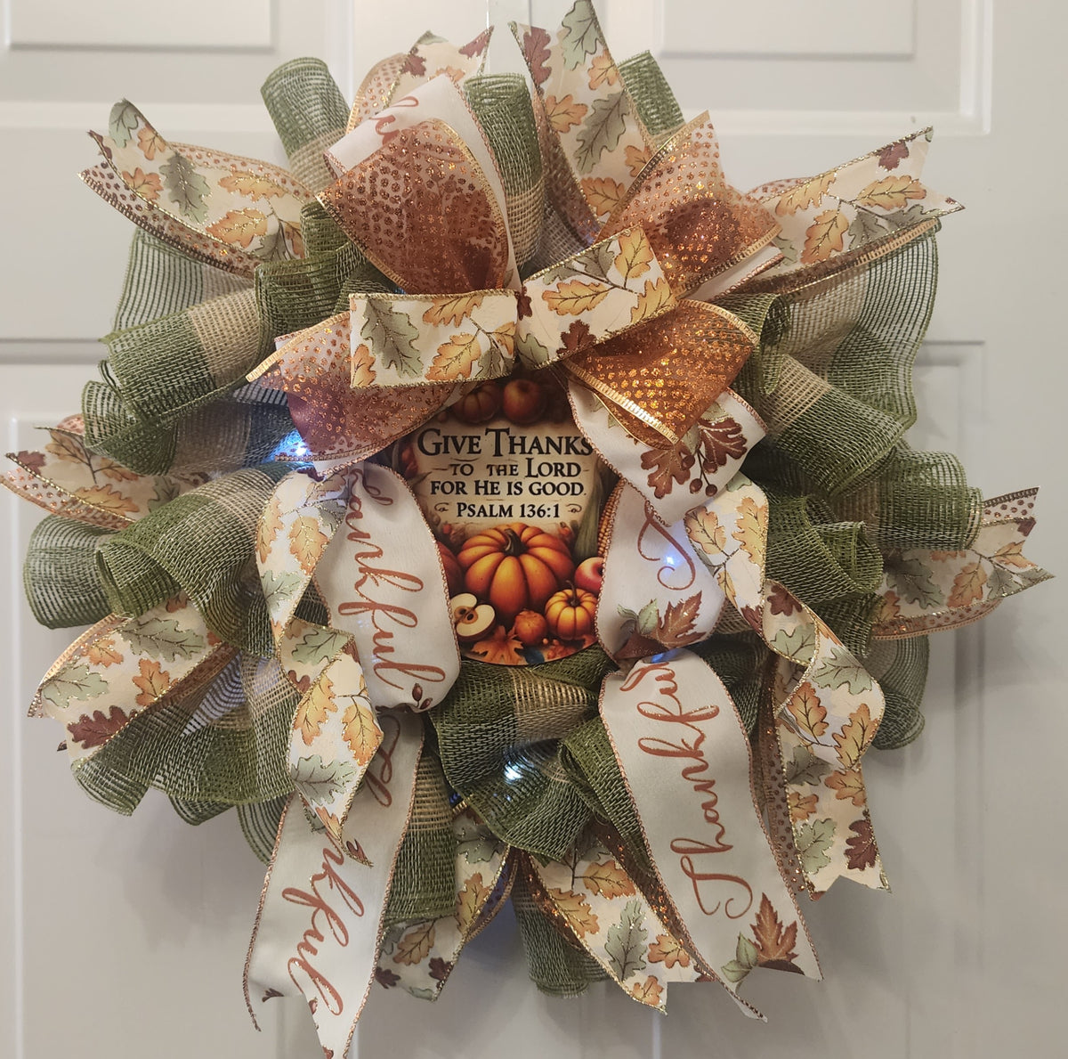 Psalm 136:1 center sign with pumpkin harvest scene detail