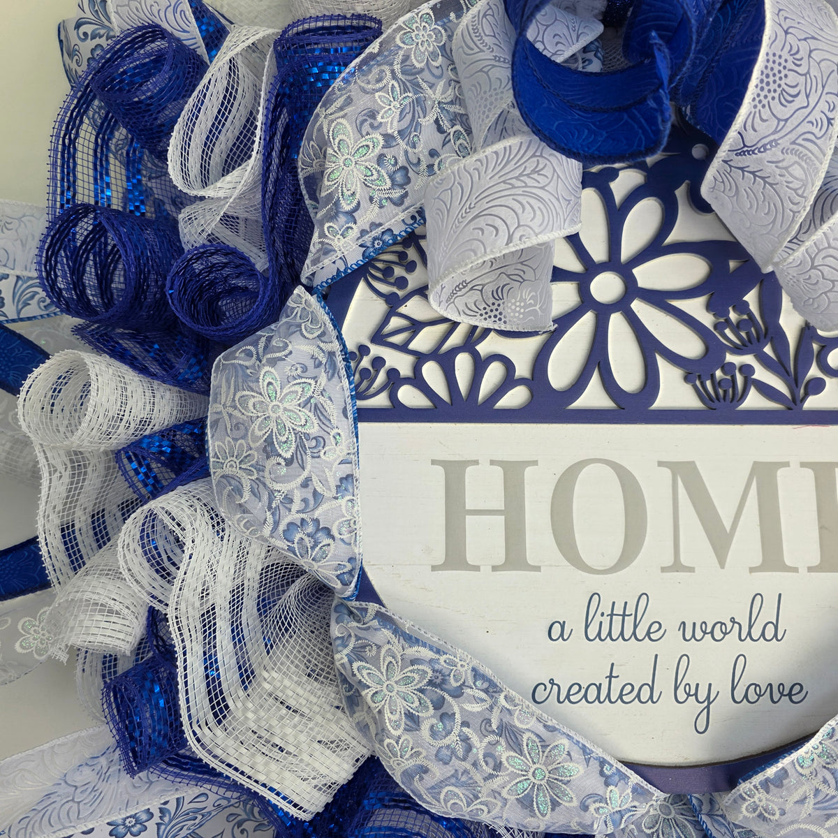 Home A Little World Created By Love Blue White Wreath - top ribbon and mesh detail