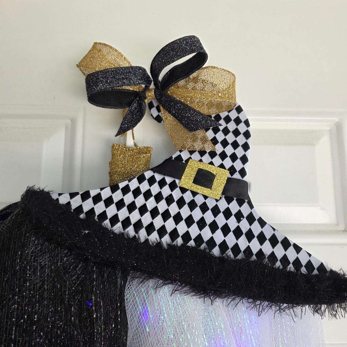 Harlequin Witch Hat LED Pumpkin Wreath - full front view on white door