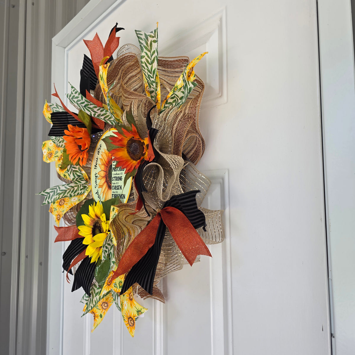 God Says You Are Sunflower Wreath - full view on white door