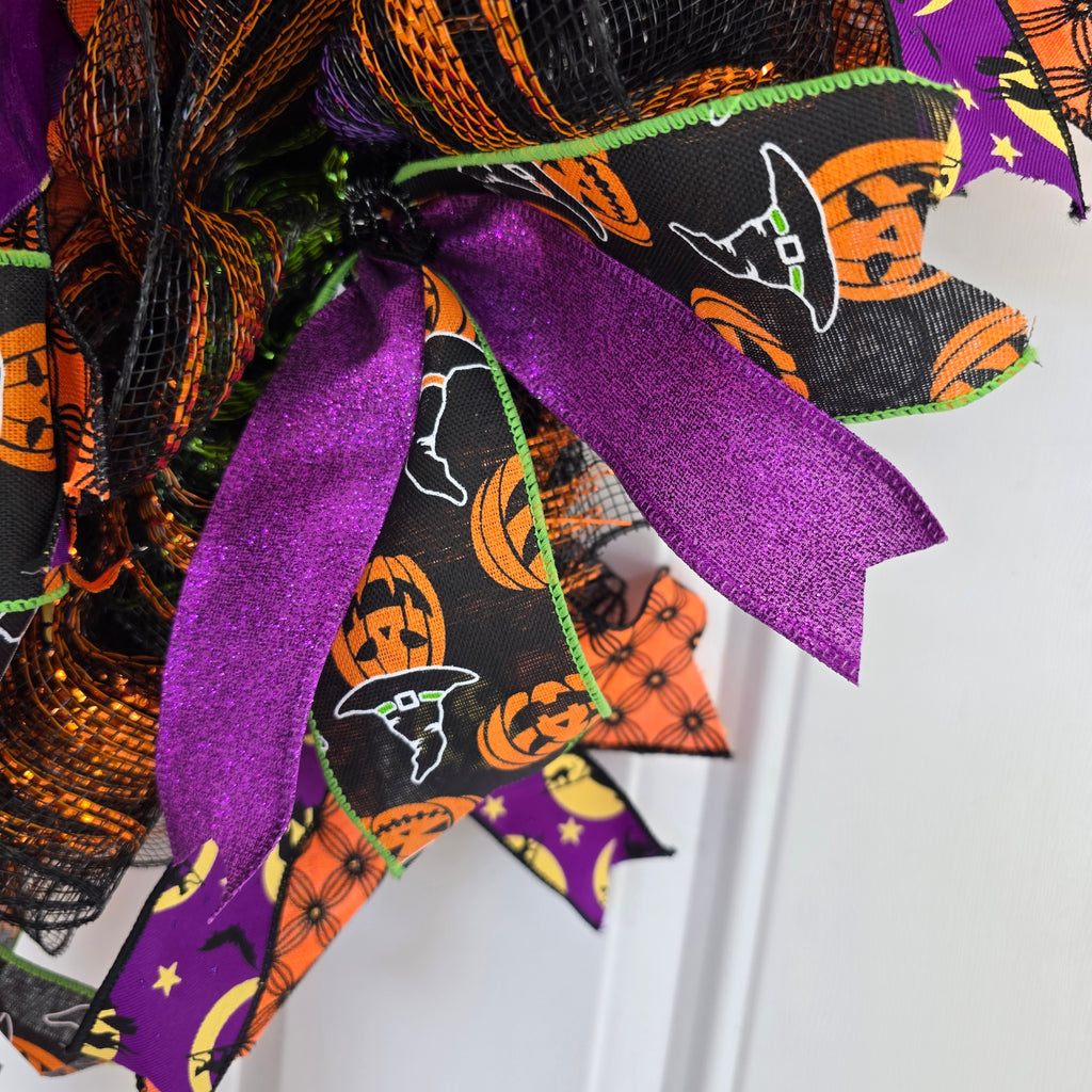 Witch's Boots Halloween Wreath - side angle on barn door