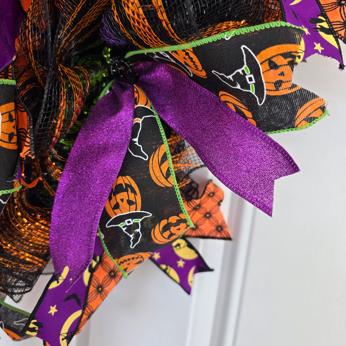 Witch's Boots Halloween Wreath - side angle on barn door