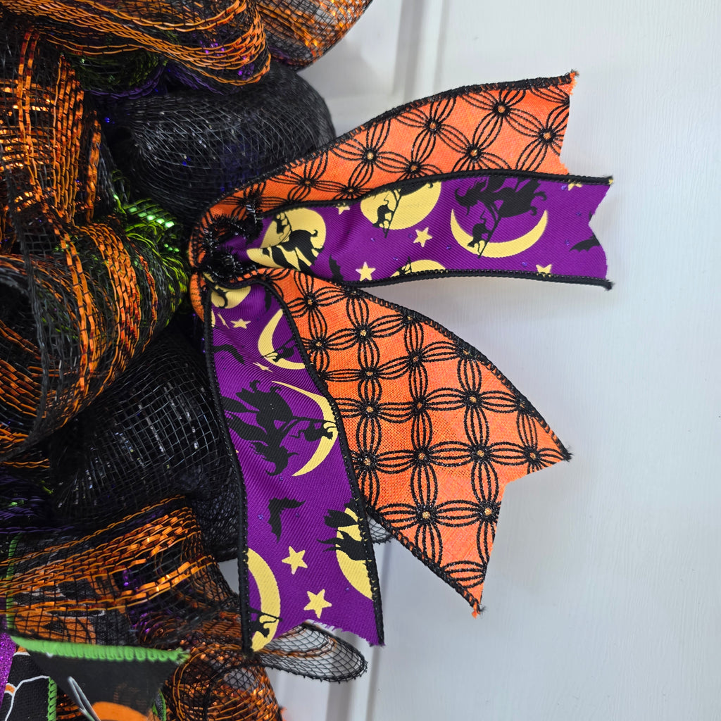 Witch's Boots Halloween Wreath - full view on white door