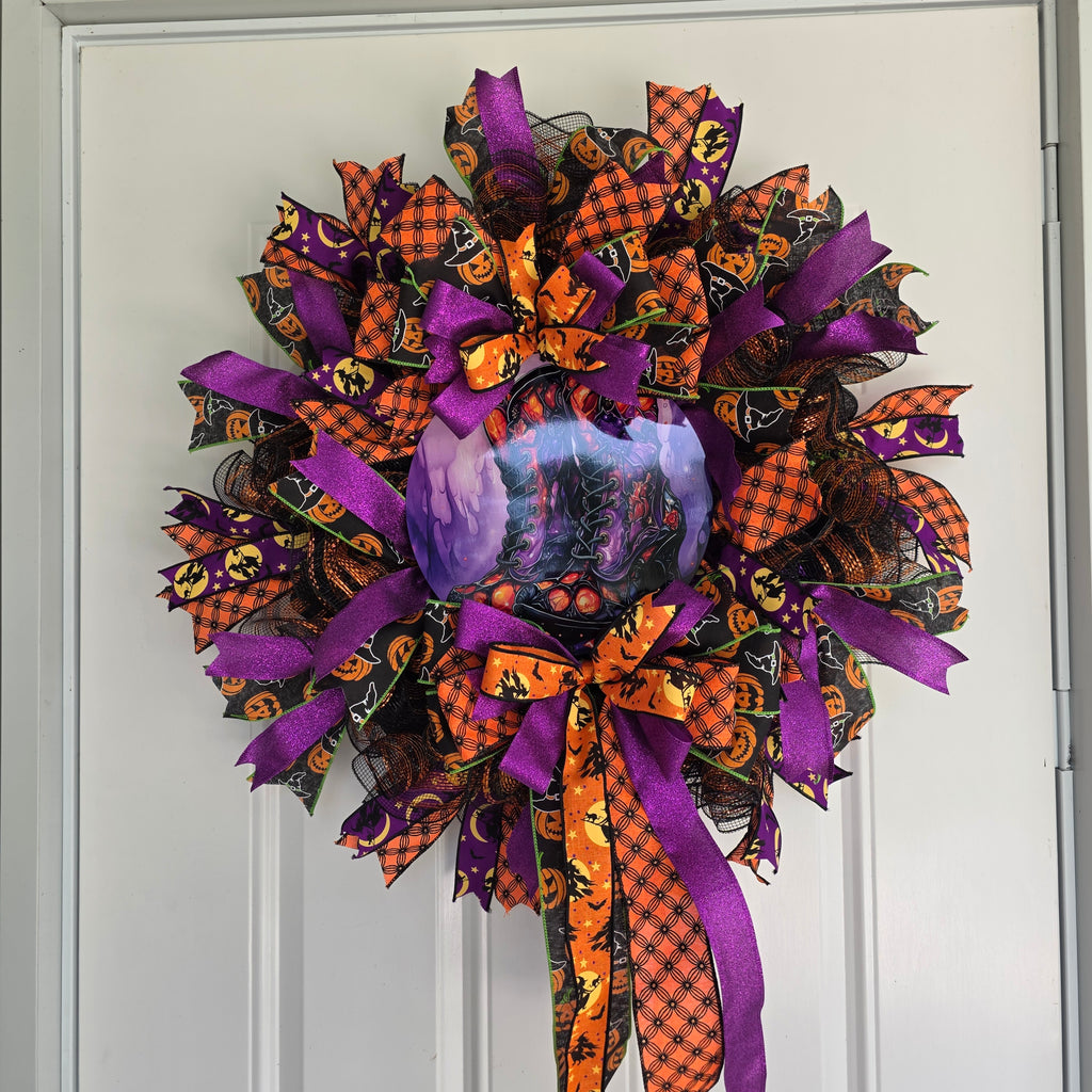 Witch's Boots Halloween Wreath - full view on white door swag style