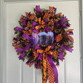 Witch's Boots Halloween Wreath - full view on white door swag style
