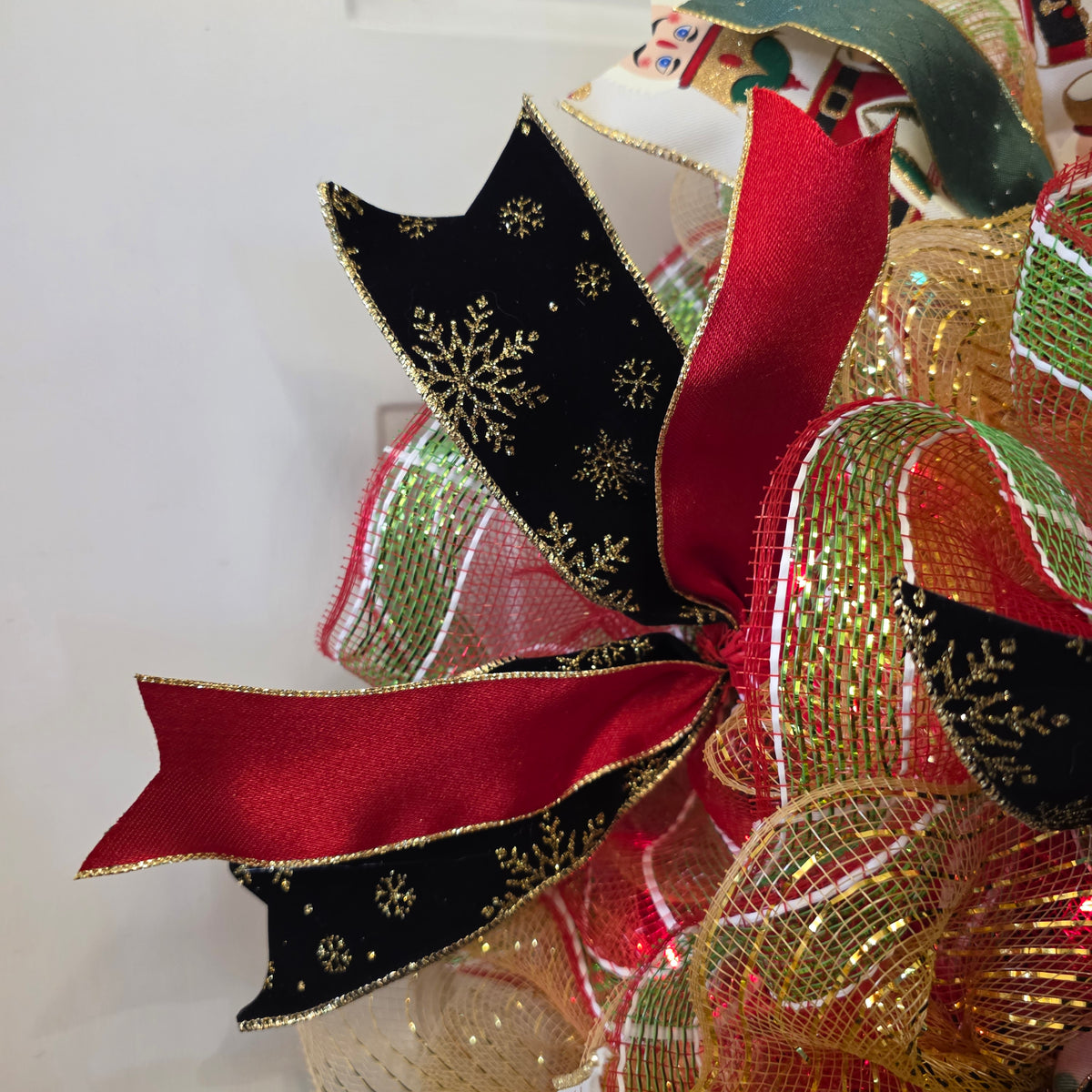 Full view of nutcracker Christmas wreath hanging on door