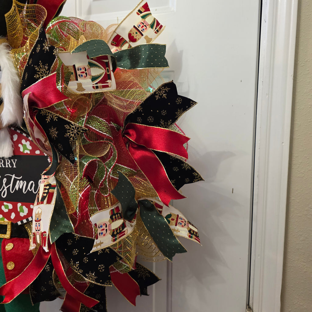 Merry Christmas sign on nutcracker wreath