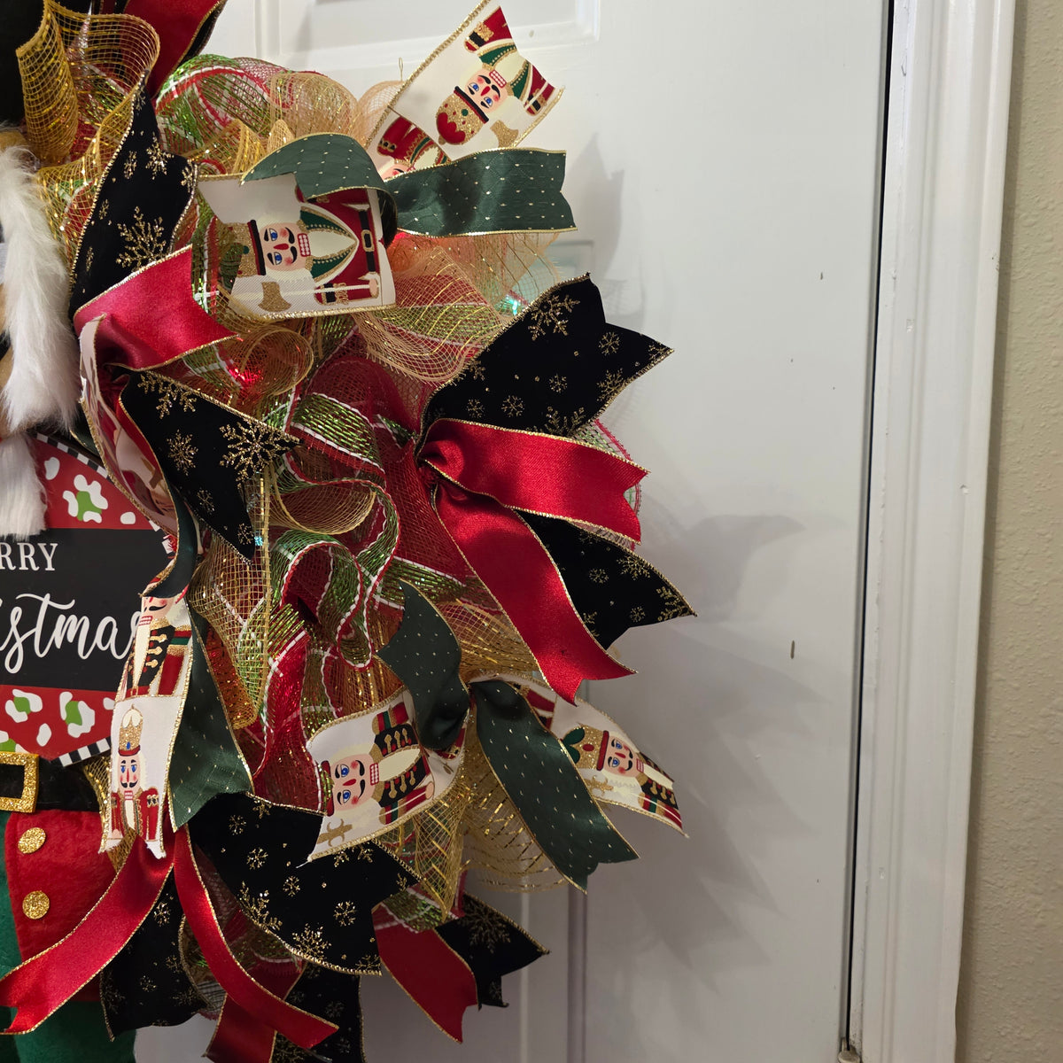 Merry Christmas sign on nutcracker wreath