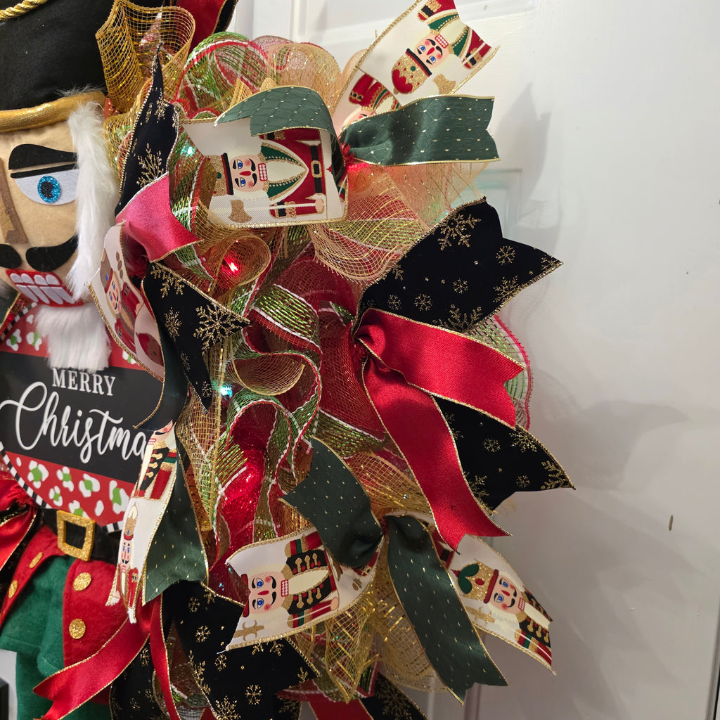 Nutcracker head with fuzzy beard and Merry Christmas sign