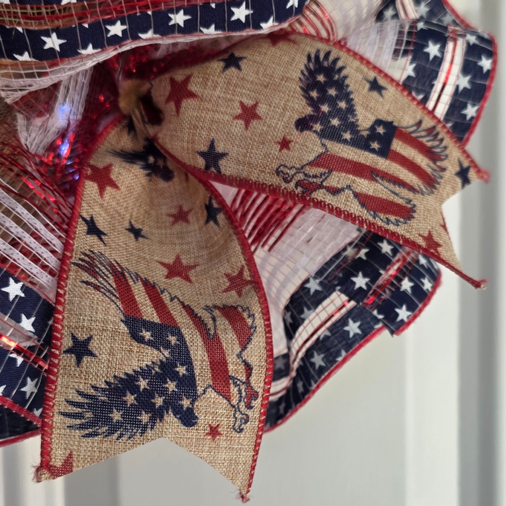 Close-up of burlap eagle and American flag ribbon detail