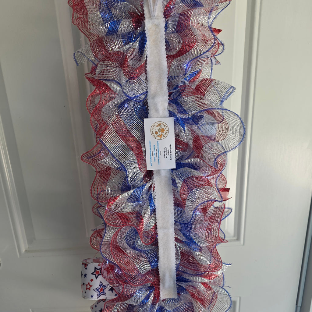 Back view of God Bless America door swag construction and fairy light battery pack