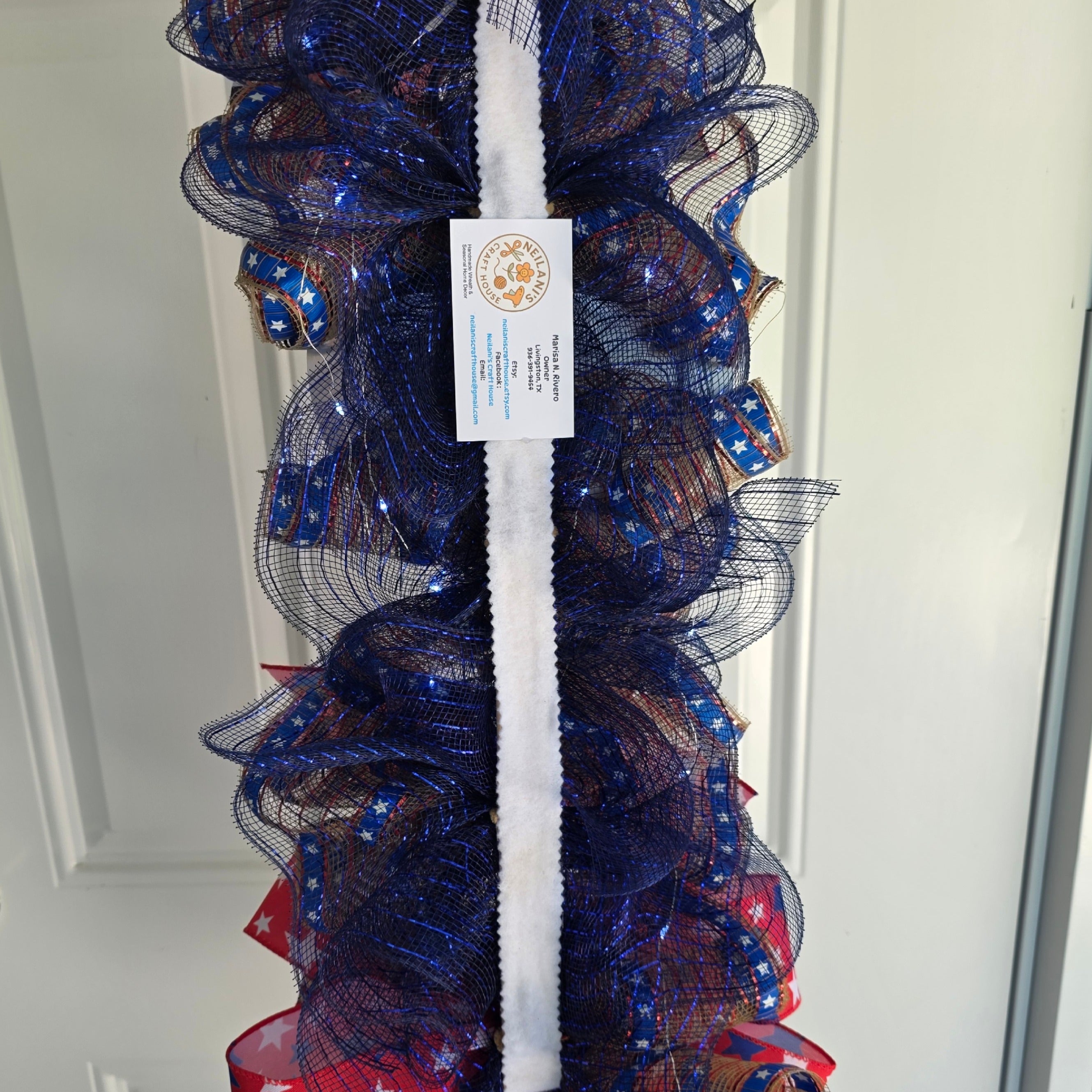 Back view of patriotic door swag construction on 21 inch stir stick base