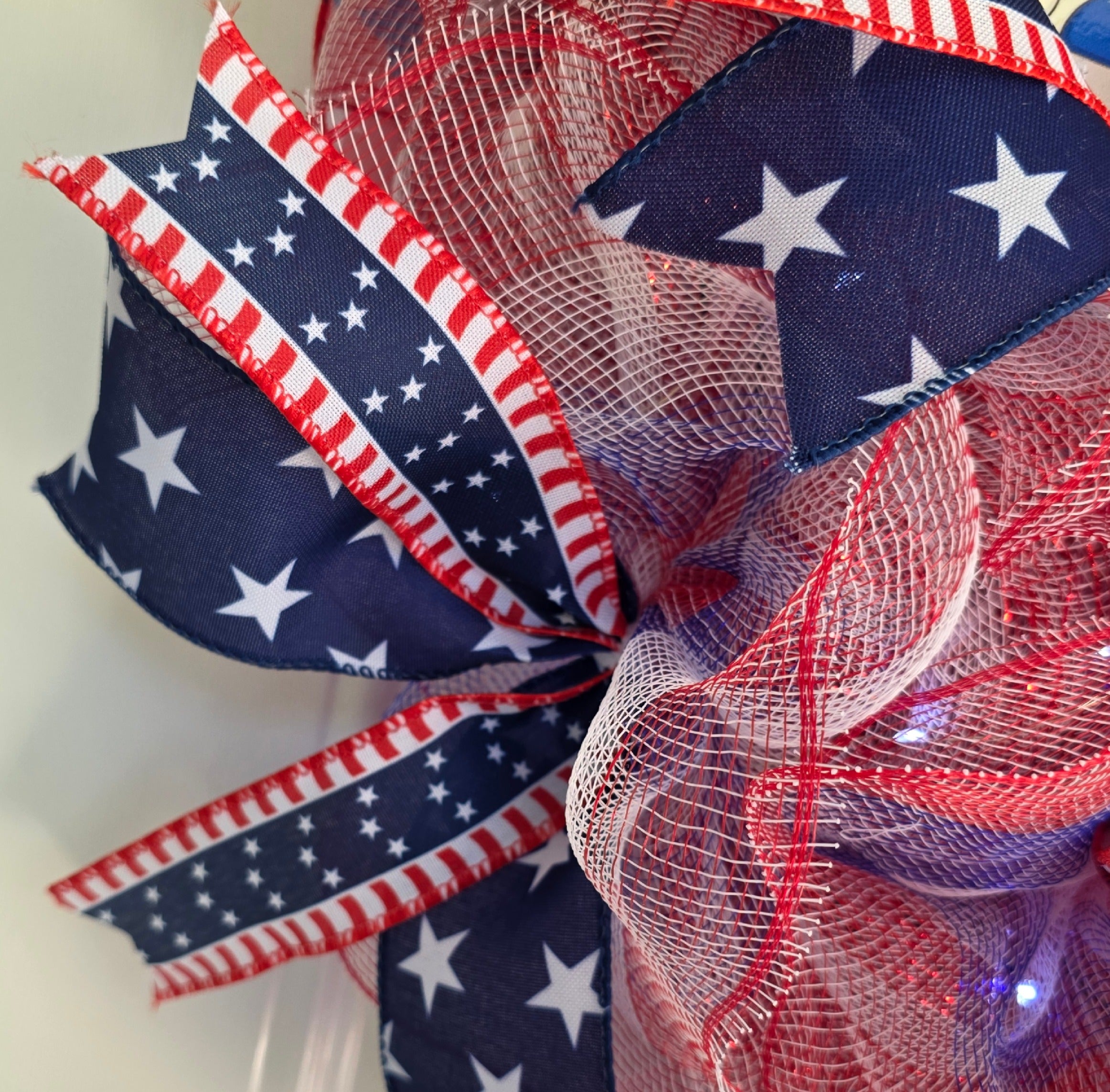 Close-up of navy blue star wired ribbon detail