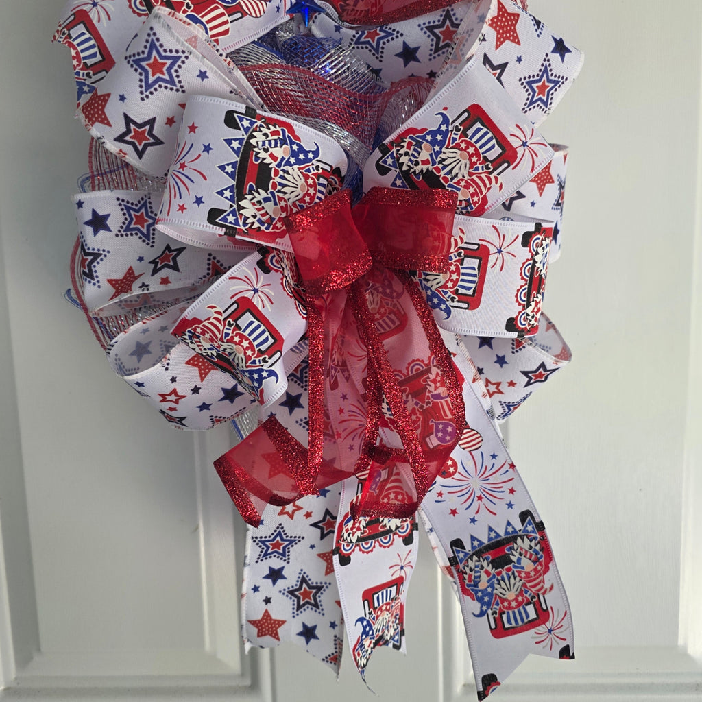 Top bow detail with patriotic gnome fireworks and star ribbon
