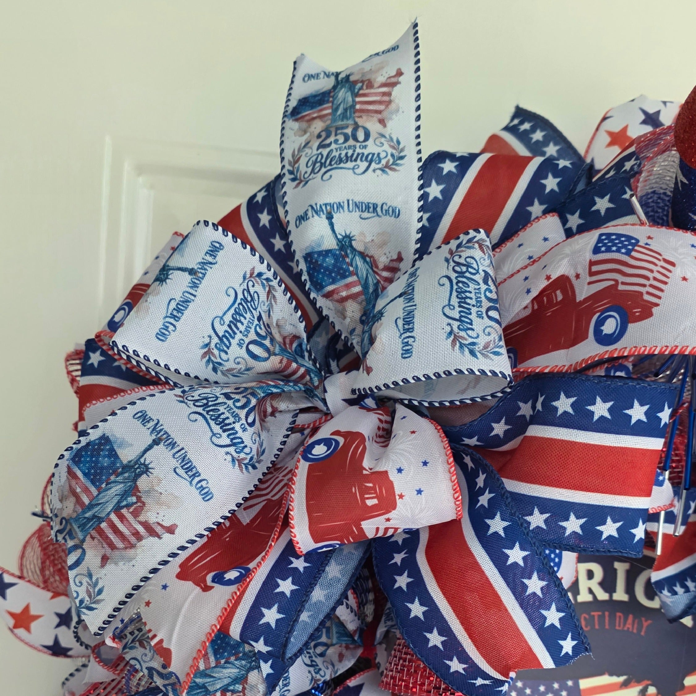 Top bow detail with fireworks and star ribbon