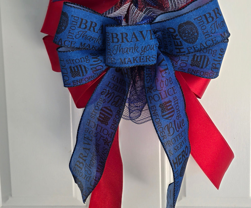 Top bow detail with glittery blue star picks and law enforcement word ribbon