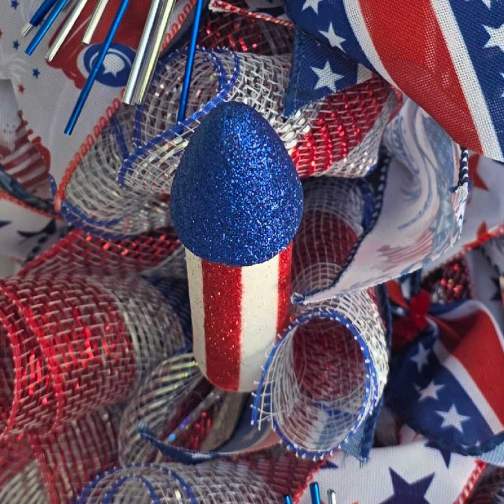 Close-up of red-striped glitter firework rocket pick detail