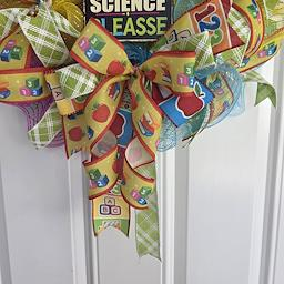 A Moment of Science Please Wreath - charm and ribbon detail