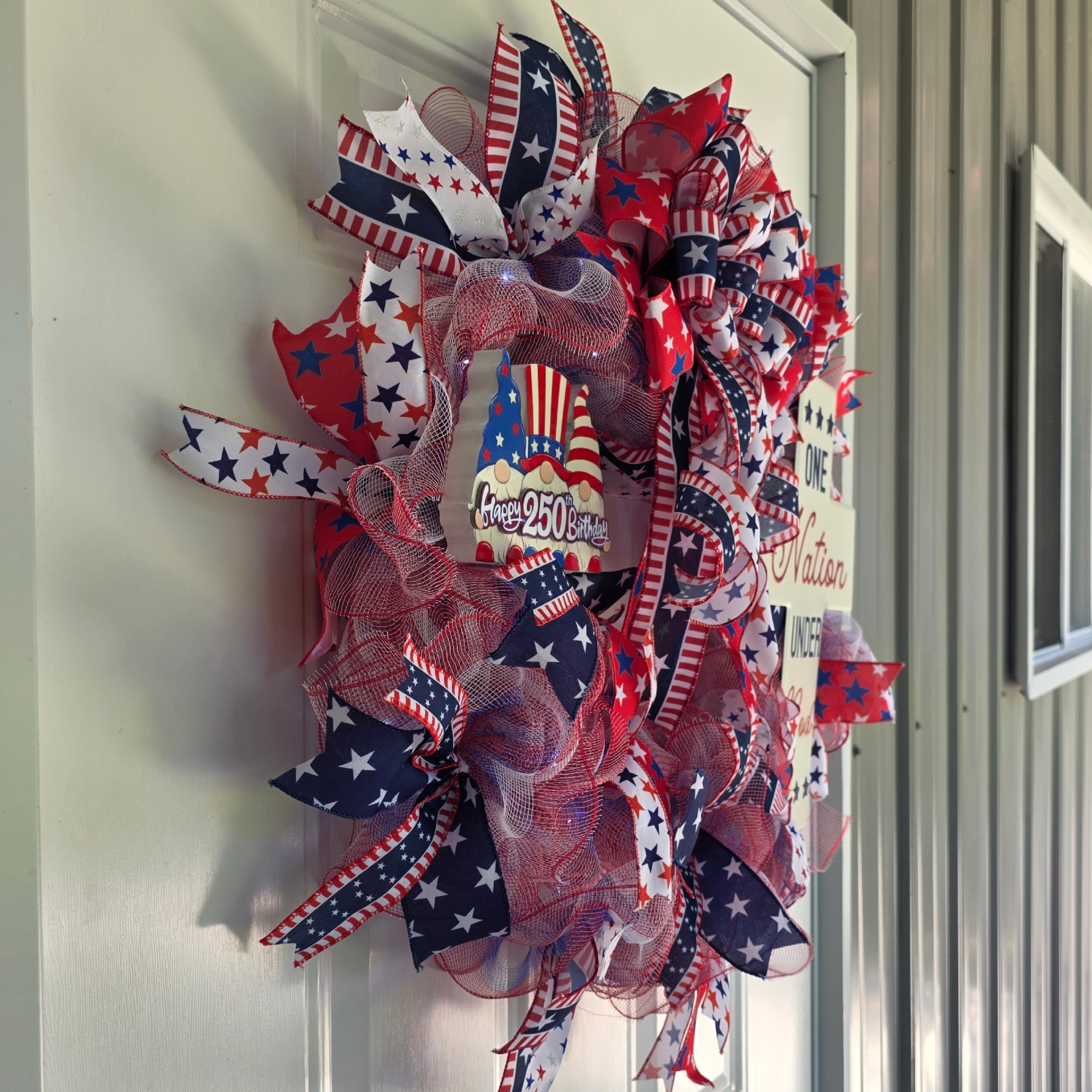 Left side view of One Nation Under God patriotic wreath on door