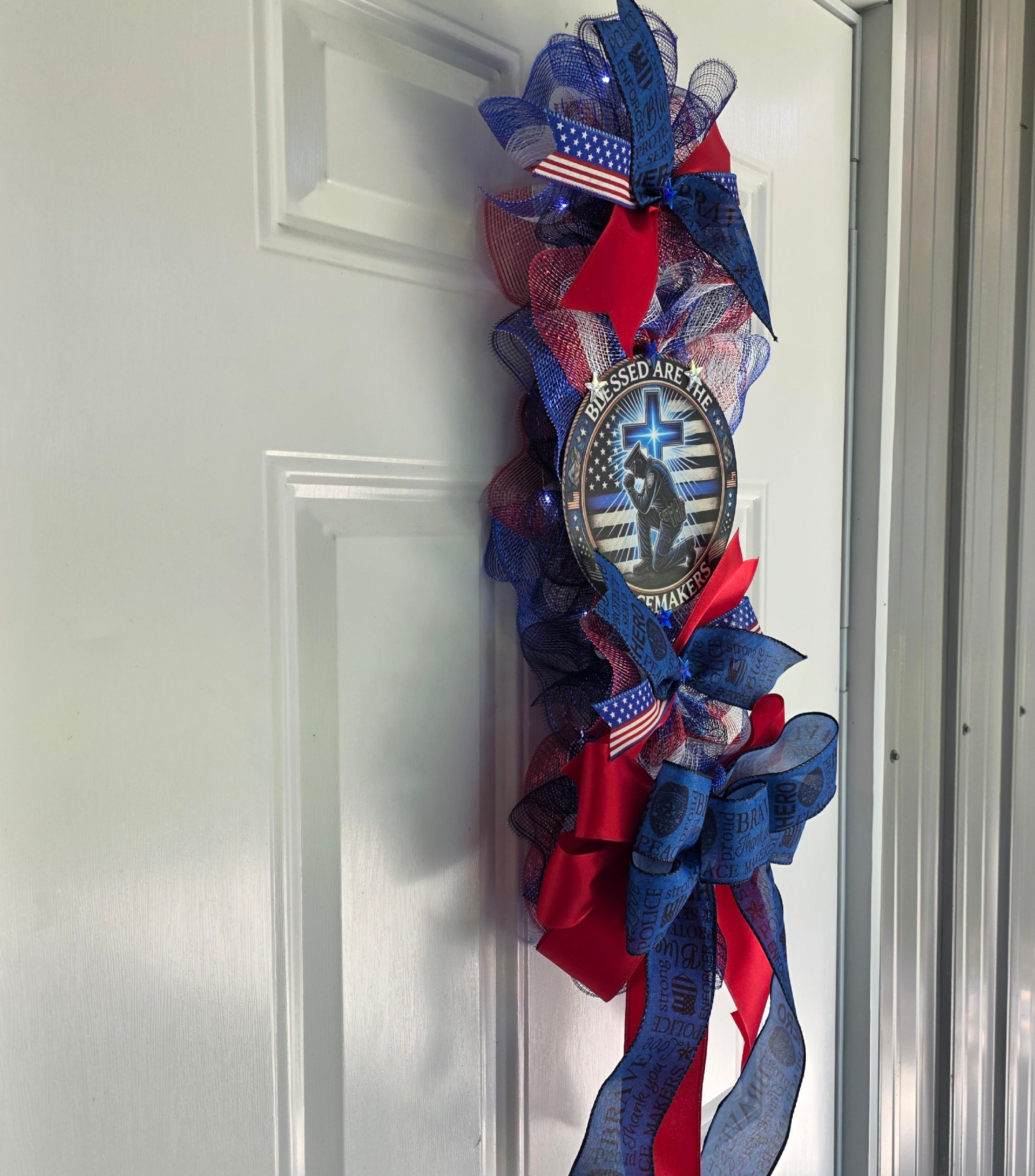 Left side view of Blessed Are The Peacemakers door swag