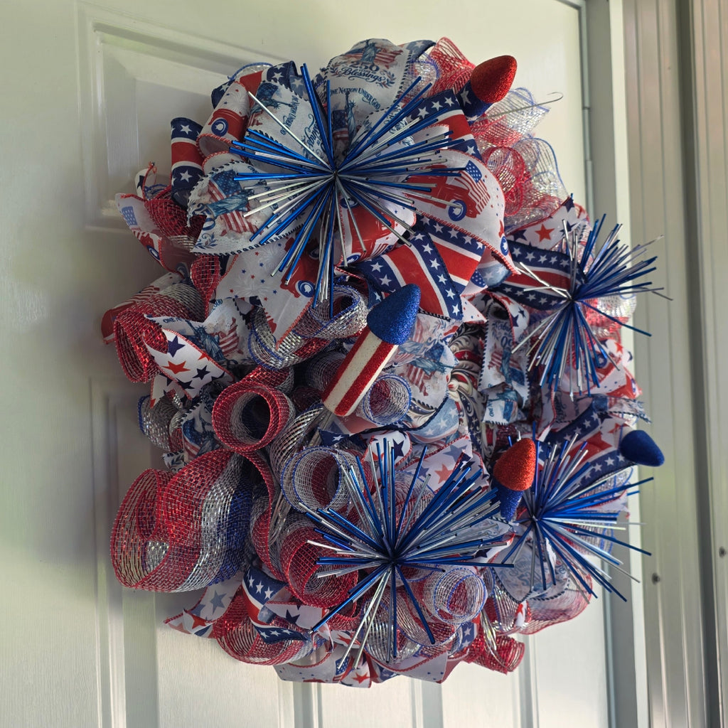 Left side view of patriotic fireworks deco mesh wreath