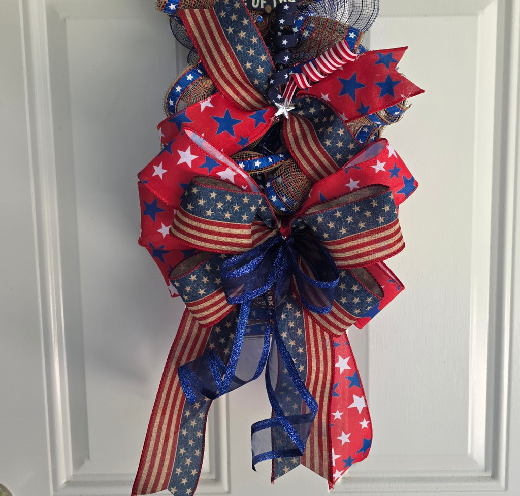 Close-up of layered red white blue star and stripe ribbon detail