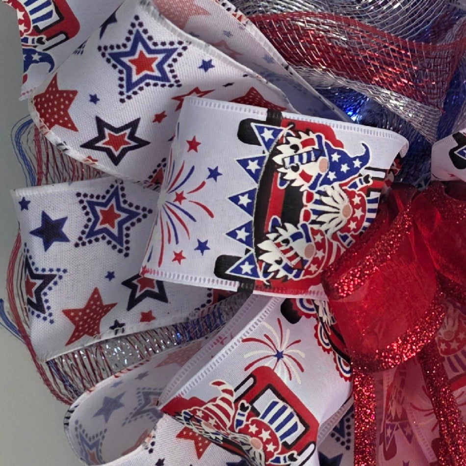 Close-up of layered patriotic ribbons with stars and gnome prints