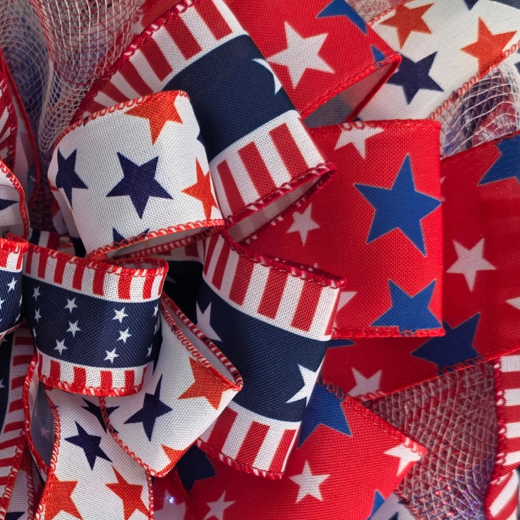 Close-up of layered patriotic star and stripe ribbon detail