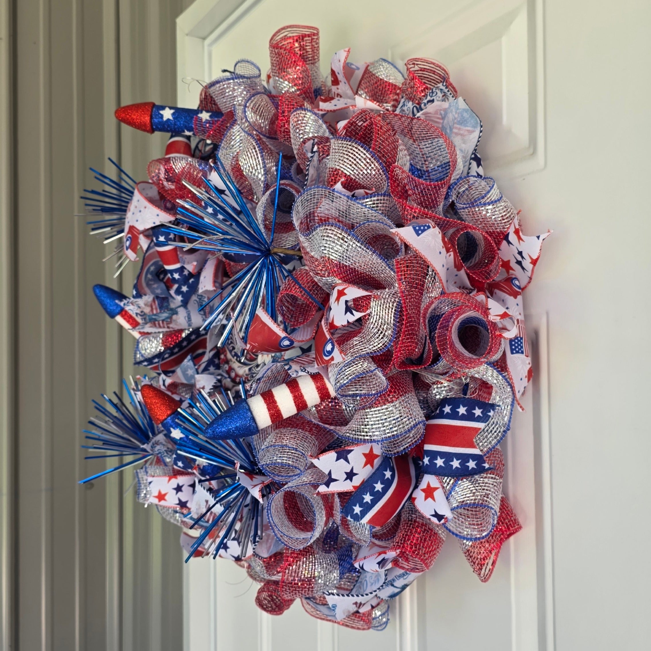 Right side view of patriotic fireworks deco mesh wreath