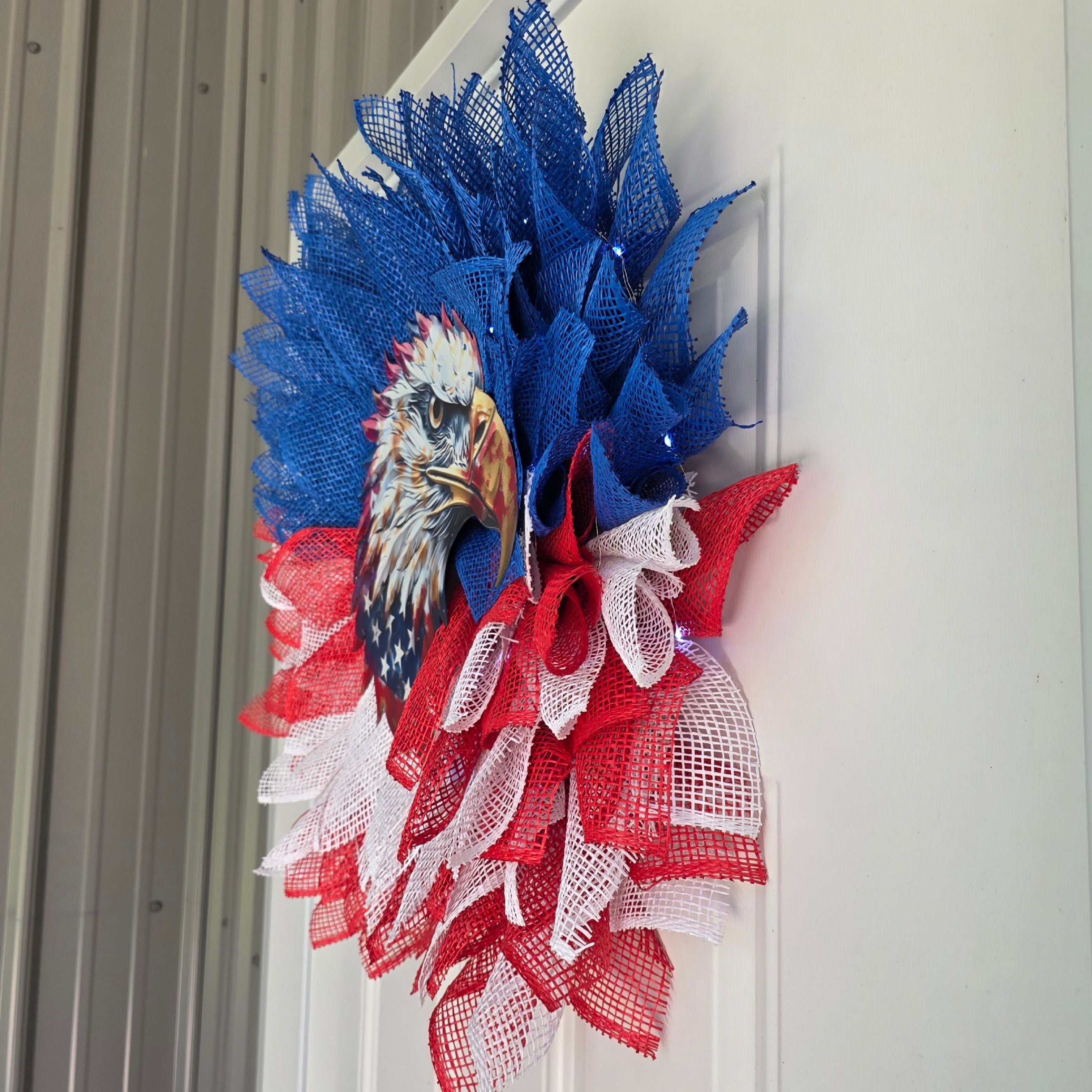 Right side view of patriotic bald eagle deco mesh wreath